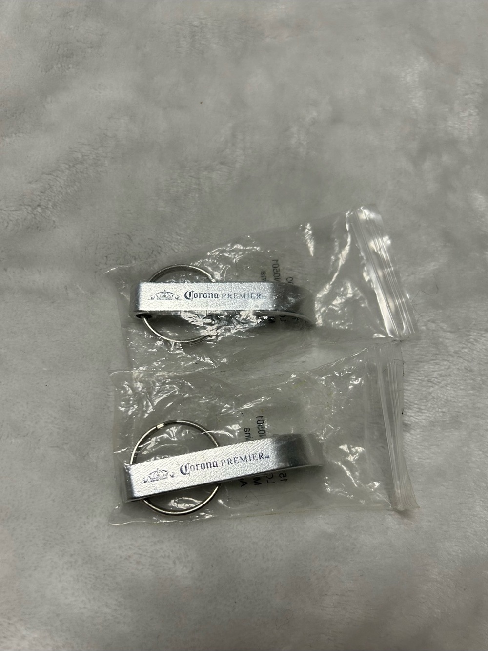 2 metal keychain bottle openers